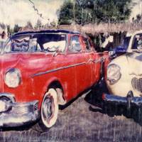 Red and white antique cars